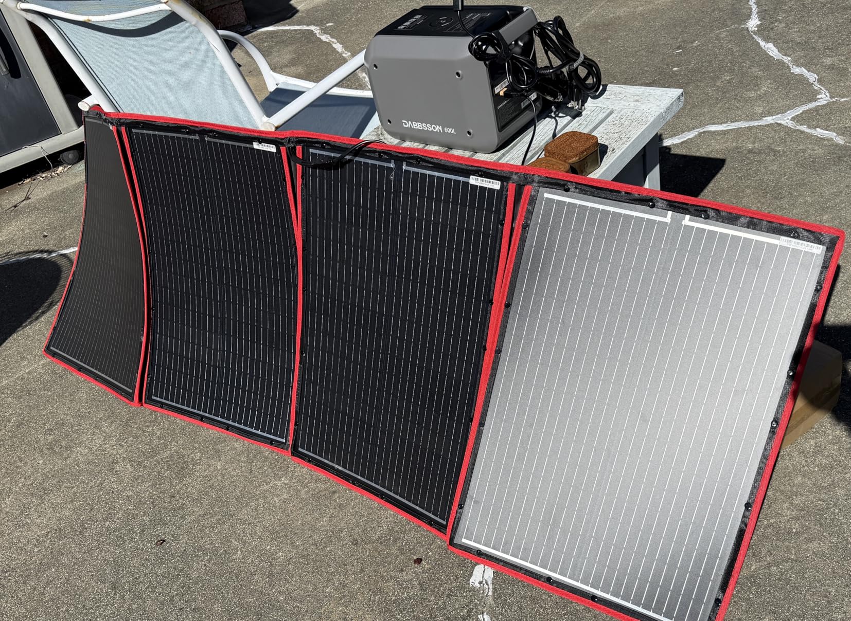 DOKIO 100W Portable Foldable Solar Panel Kit for 12V Battery Charging | Folds to 19 x 26 in and weighs 5.3 lb; includes controller and dual USB; for 12V batteries, power stations and camping. customer photo 1