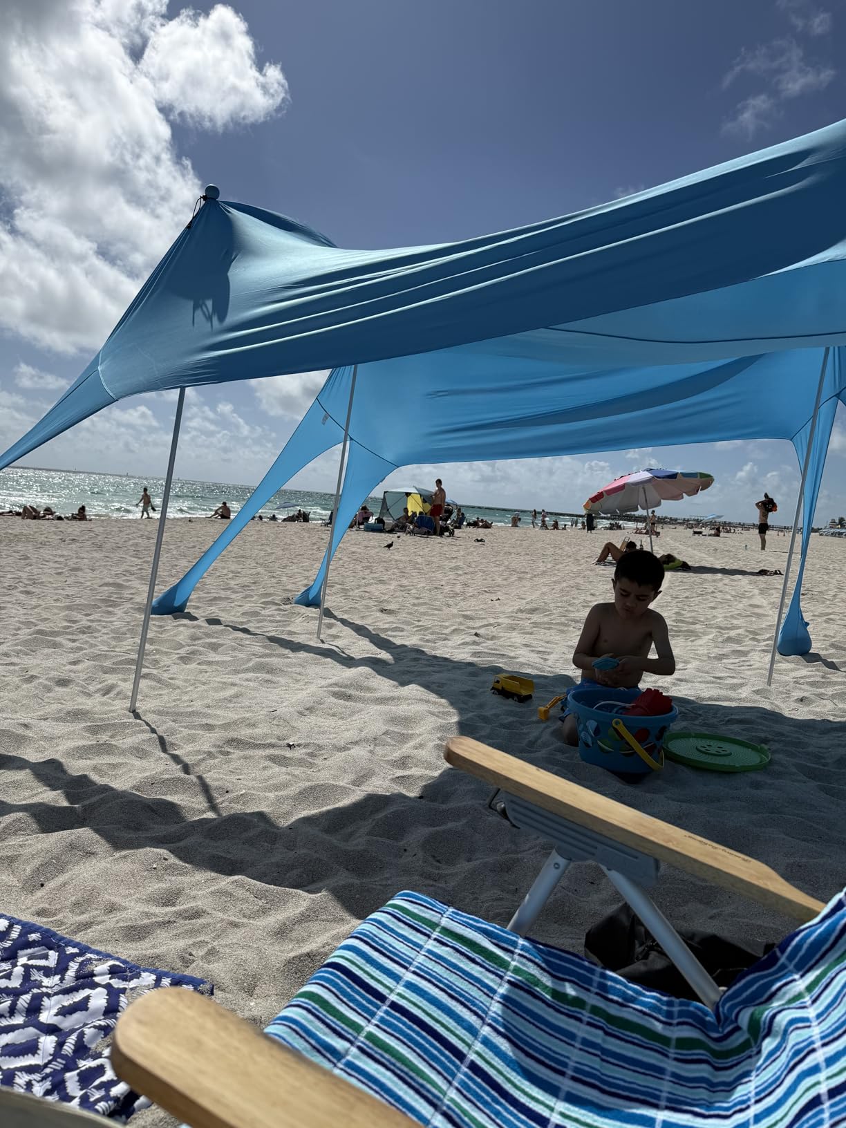 Rhino Valley Beach Tent, 10 x 10 FT Beach Shade UPF50+ Protection, Beach Canopy with 8 Sandbags 4 Stability Poles, Outdoor Beach Tent Sun Shelter Umbrella for Sand,Camping,Fishing Essentials, Sky Blue customer photo 2