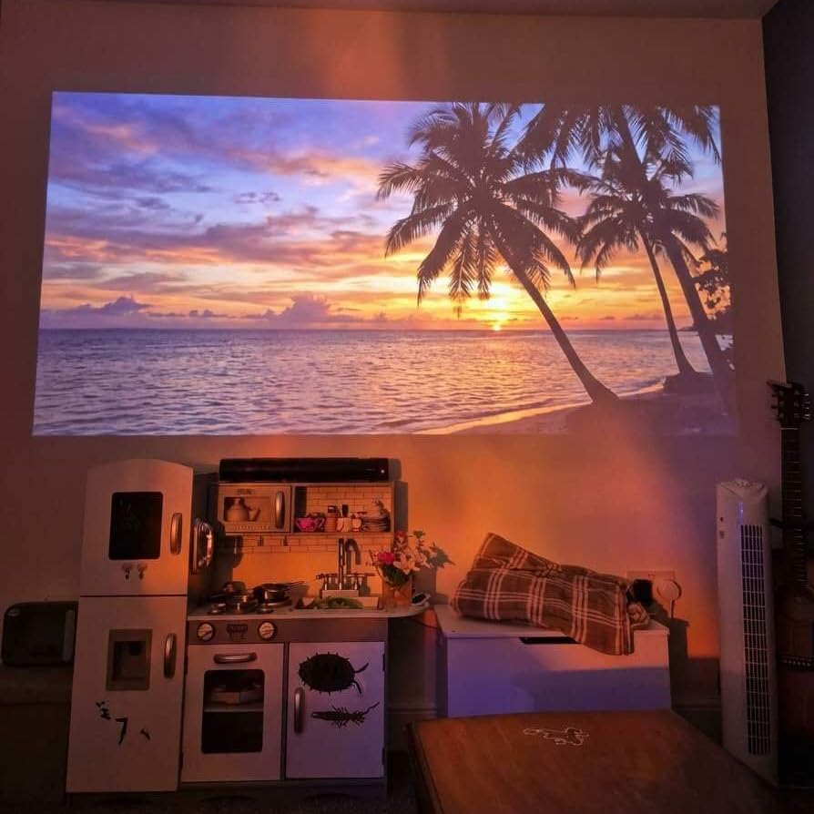 Smart Projector [Bundled with Google TV Stick & 4K Support] with WiFi and Bluetooth, Portable Mini Movie Short Throw Projector Outdoor with Built-in Apps Auto Focus for Home Theater Bedroom Ceiling customer photo 1