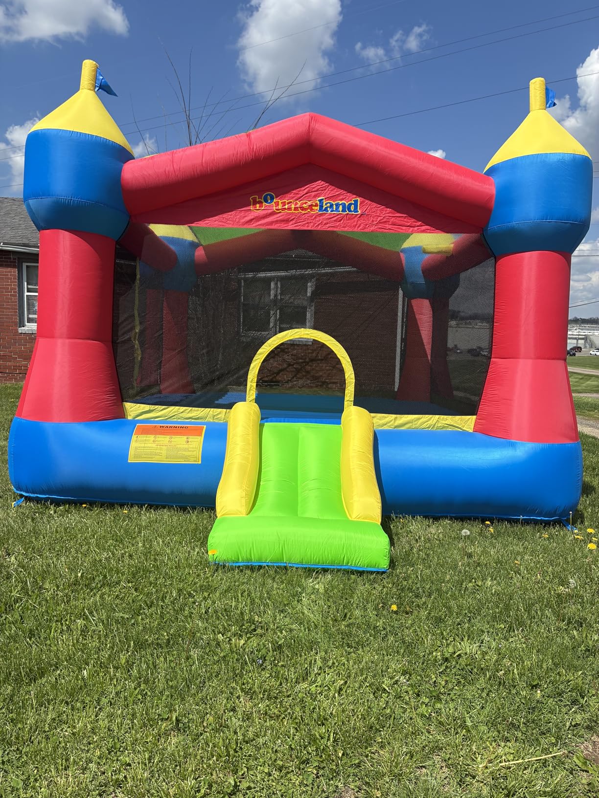 Bounceland Inflatable Party Castle Bounce House Bouncer, 16 ft L x 13 ft W x 10.3 ft H, Basketball Hoop, Removable Sun Roof, UL Strong Blower included, Fun Slide and Bounce Area, Castle Theme for Kids customer photo 2