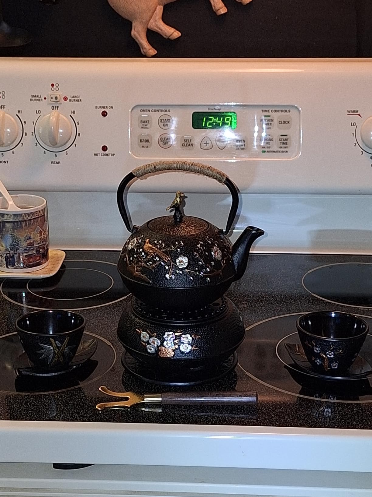Dyna-Living Cast Iron Teapot with Warmer Japanese Tea Kettle 720ml/24.5oz Japanese Cast Iron Teapot Set with 2 Tea Cups Tea Pot with Infuser Tea Kettle for Wood Stove or Stovetop customer photo 2