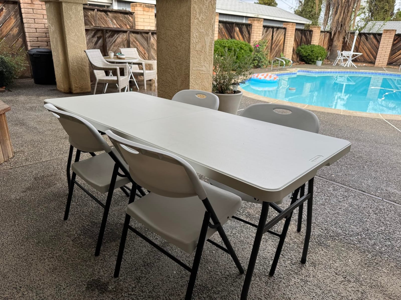 Amazon Basics Heavy Duty Portable Folding Table, 6 ft, Indoor & Outdoor, Fold-in-Half Design with Carrying Handle, White | Portable customer photo 2