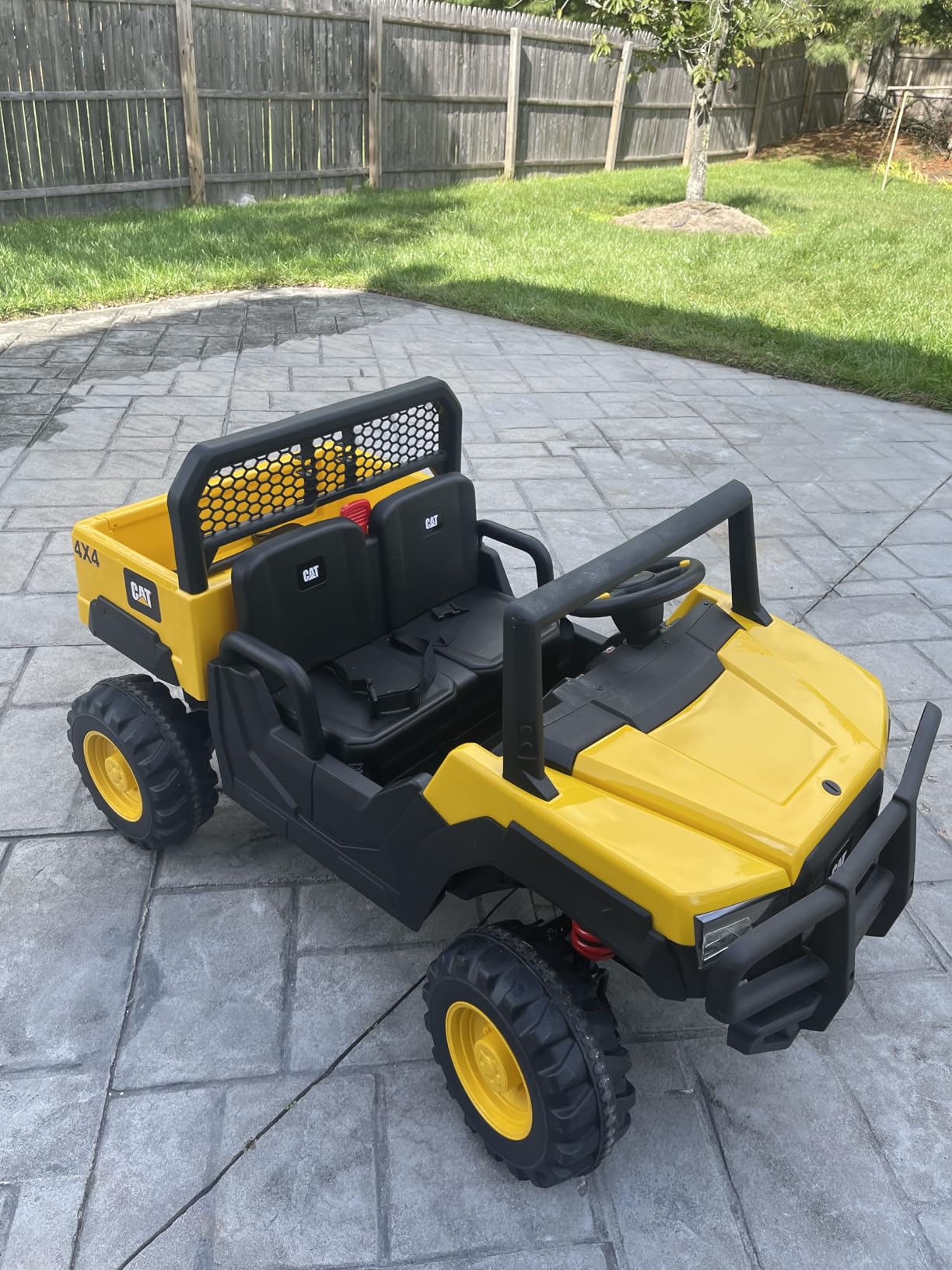 Costzon 2-Seater Licensed Caterpillar Ride on Dump Truck, 24V Kids Car Electric Vehicle with Remote Control, 4 x 100W Motors, Soft Start & Spring Suspension, Kids UTV with Dump Bed, Gift, Yellow customer photo 1