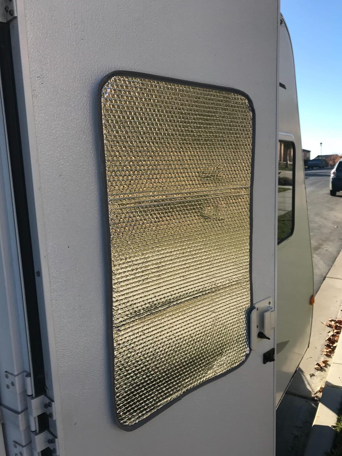 Camco 45167 SunShield Reflective Door Window Cover | Helps Protect Your RV from Harmful UV Rays and Regulates RV Temperature | 16
