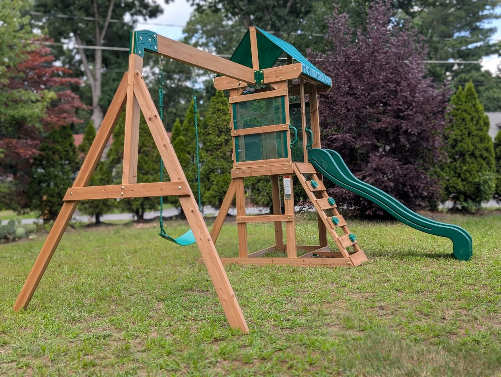 Backyard Discovery Buckley Hill Cedar Wood Swing Set with Wave Slide, Play Deck, Rock Wall Ladder, Belt Swings, Chalkboard, Canopy Roof, Outdoor Playset customer photo 1