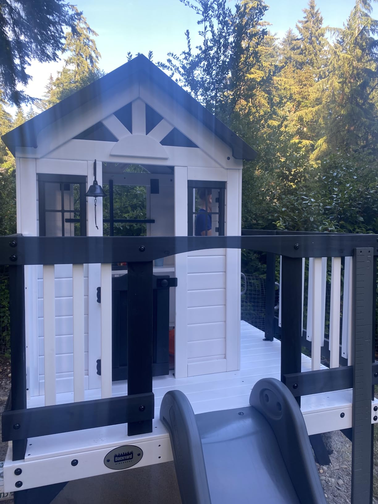 Backyard Discovery Echo Heights Elevated Cedar Wooden Kids Playhouse with Wave Slide, Play Kitchen, Wrap-Around Deck, Flat-Step Ladder, Half Door, Windows, Bell, and Growth Chart for Outdoor Play customer photo 1